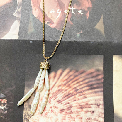 Agete necklace charm with stick-shaped freshwater pearls, silver chain, labradorite stone, and tassel