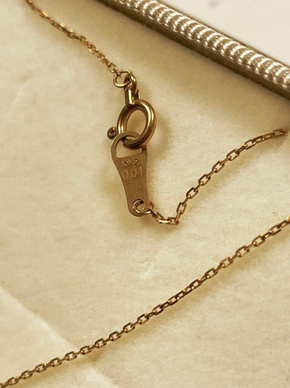 Agat K10 necklace in yellow gold with 5 mm pendant and 40 cm chain displayed on white background
