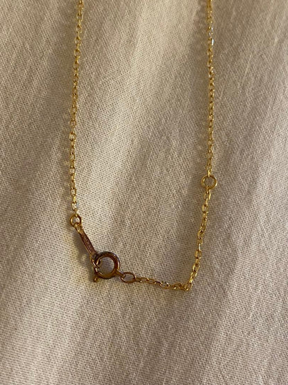 MIKIMOTO K18 necklace featuring a single pearl on a delicate gold chain