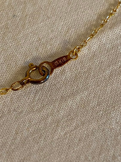MIKIMOTO K18 necklace featuring a single pearl on a delicate gold chain