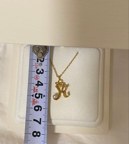 MIKIMOTO K18 necklace featuring a single pearl on a delicate gold chain