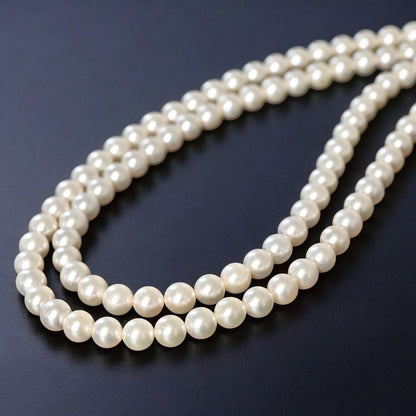 Double strand Tasaki Akoya pearl necklace with round 6.1-6.3 mm pearls and silver clasp