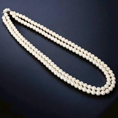 Double strand Tasaki Akoya pearl necklace with round 6.1-6.3 mm pearls and silver clasp