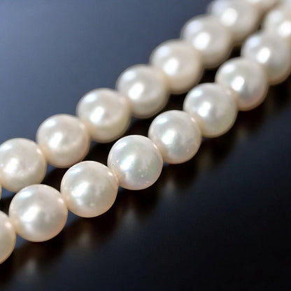 Double strand Tasaki Akoya pearl necklace with round 6.1-6.3 mm pearls and silver clasp