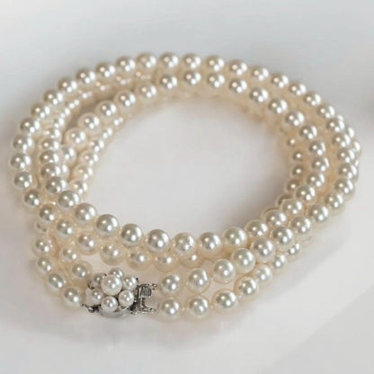 Double strand Tasaki Akoya pearl necklace with round 6.1-6.3 mm pearls and silver clasp