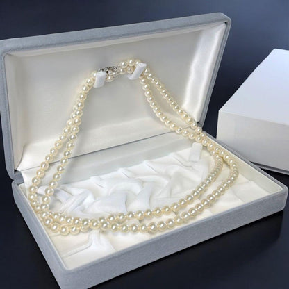 Double strand Tasaki Akoya pearl necklace with round 6.1-6.3 mm pearls and silver clasp
