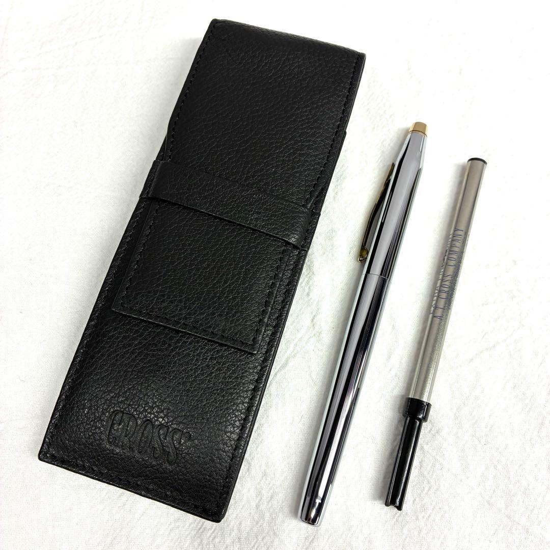 Silver CROSS ballpoint pen with dedicated case and replacement ink on a white background