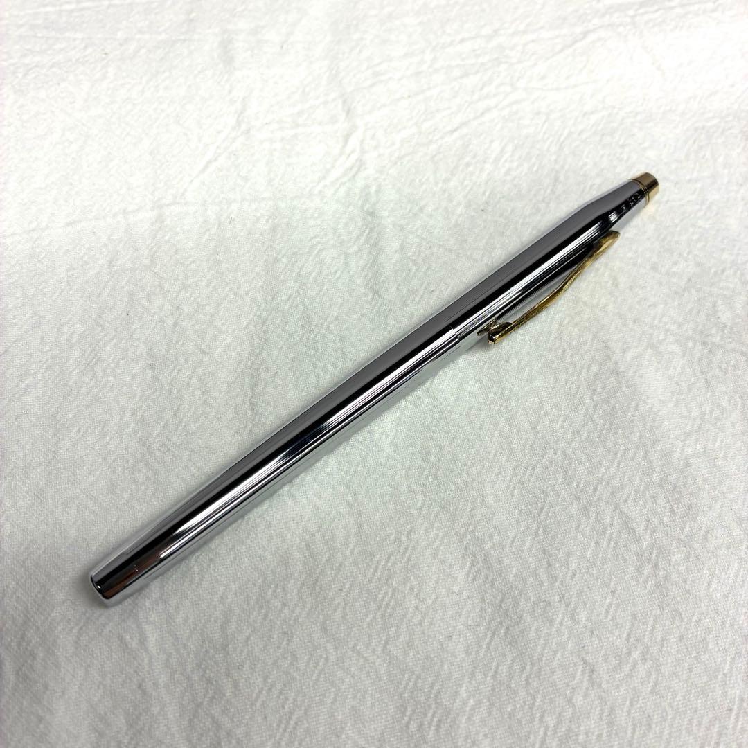 Silver CROSS ballpoint pen with dedicated case and replacement ink on a white background