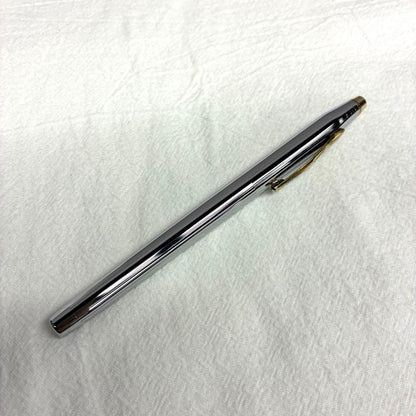 Silver CROSS ballpoint pen with dedicated case and replacement ink on a white background