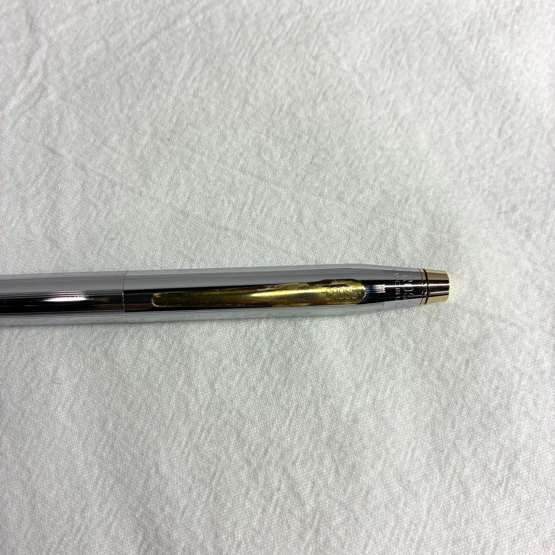 Silver CROSS ballpoint pen with dedicated case and replacement ink on a white background