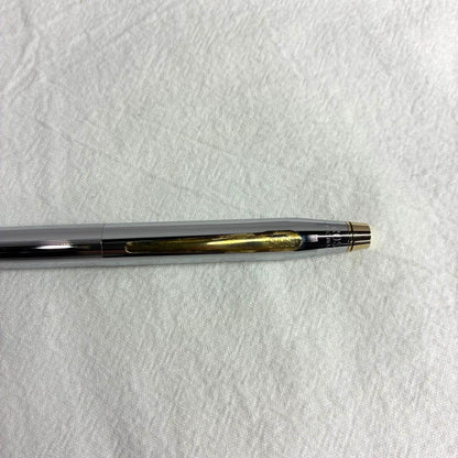 Silver CROSS ballpoint pen with dedicated case and replacement ink on a white background