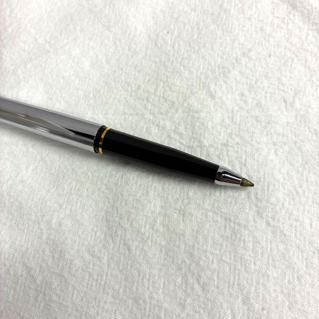 Silver CROSS ballpoint pen with dedicated case and replacement ink on a white background