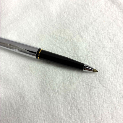 Silver CROSS ballpoint pen with dedicated case and replacement ink on a white background