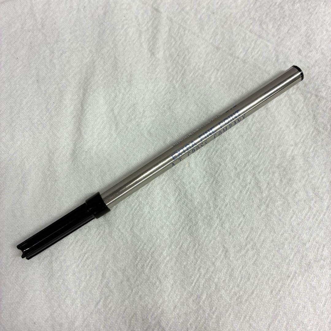 Silver CROSS ballpoint pen with dedicated case and replacement ink on a white background