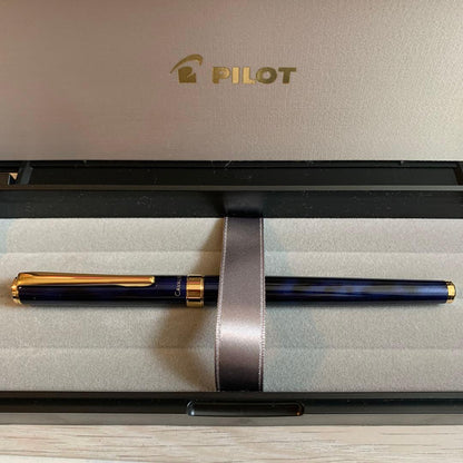 Pilot Cavalier Fountain Pen in dark blue with silver trim shown uncapped on white background