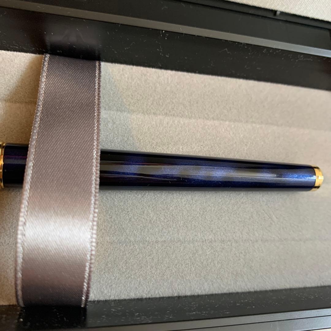 Pilot Cavalier Fountain Pen in dark blue with silver trim shown uncapped on white background