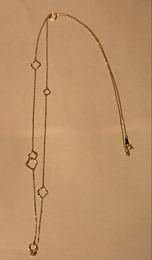 Agete K10YG long necklace in yellow gold with 80cm length displayed on a white background