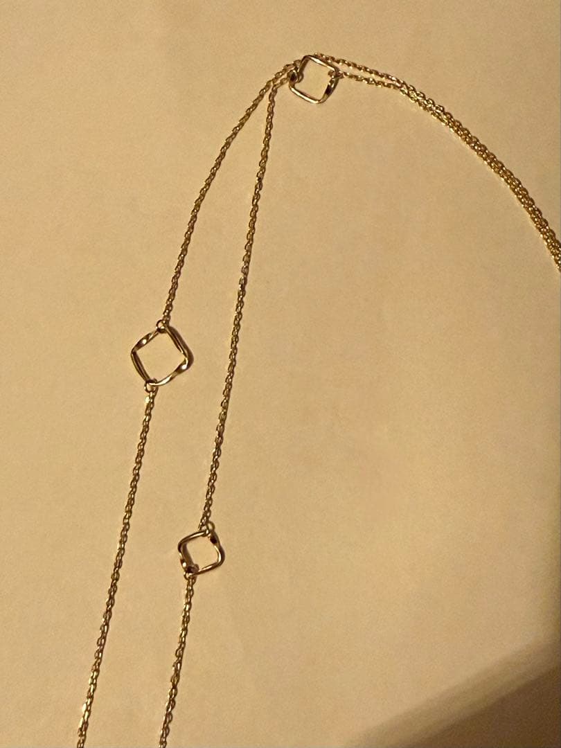 Agete K10YG long necklace in yellow gold with 80cm length displayed on a white background