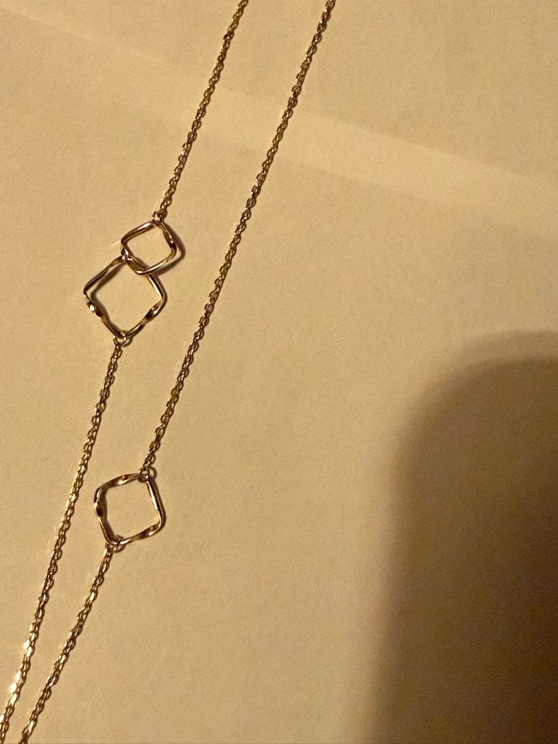 Agete K10YG long necklace in yellow gold with 80cm length displayed on a white background