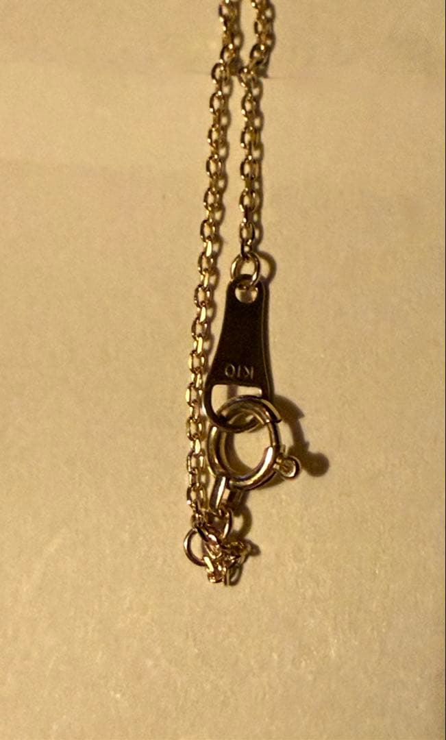 Agete K10YG long necklace in yellow gold with 80cm length displayed on a white background