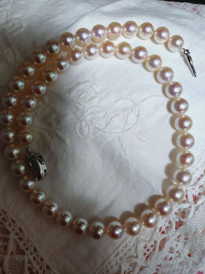 Akoya pearl necklace featuring large 8.5-9mm pink tone pearls with good luster displayed with Mitsukoshi case