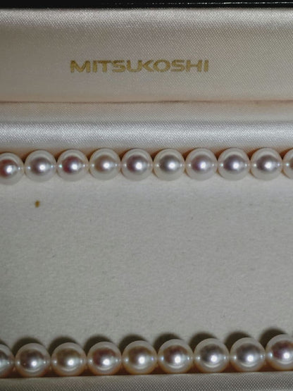 Akoya pearl necklace featuring large 8.5-9mm pink tone pearls with good luster displayed with Mitsukoshi case