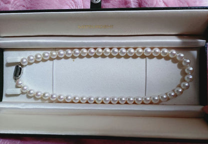 Akoya pearl necklace featuring large 8.5-9mm pink tone pearls with good luster displayed with Mitsukoshi case