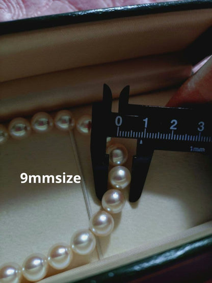 Akoya pearl necklace featuring large 8.5-9mm pink tone pearls with good luster displayed with Mitsukoshi case