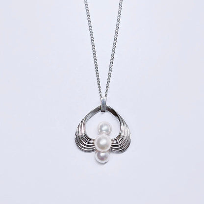 Mikimoto silver pearl necklace pendant top with 6.2-6.9mm round pearls on a white background