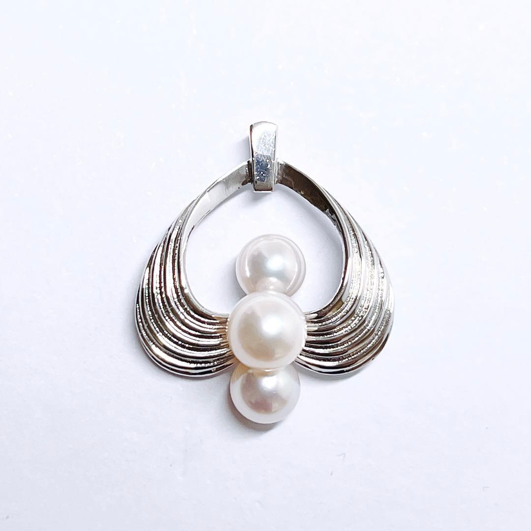 Mikimoto silver pearl necklace pendant top with 6.2-6.9mm round pearls on a white background