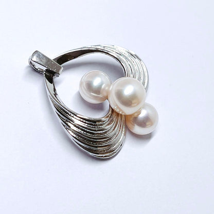 Mikimoto silver pearl necklace pendant top with 6.2-6.9mm round pearls on a white background