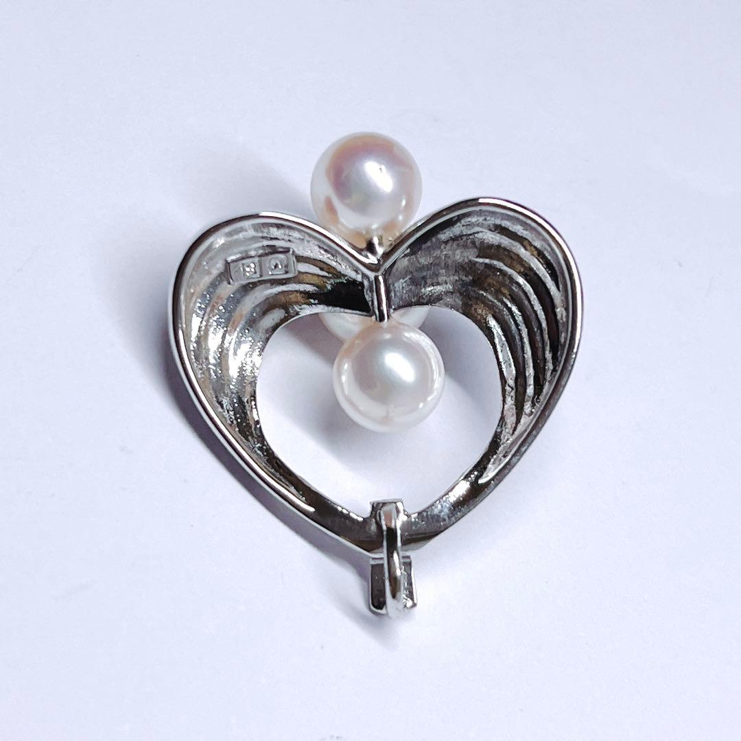 Mikimoto silver pearl necklace pendant top with 6.2-6.9mm round pearls on a white background