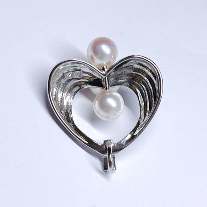 Mikimoto silver pearl necklace pendant top with 6.2-6.9mm round pearls on a white background
