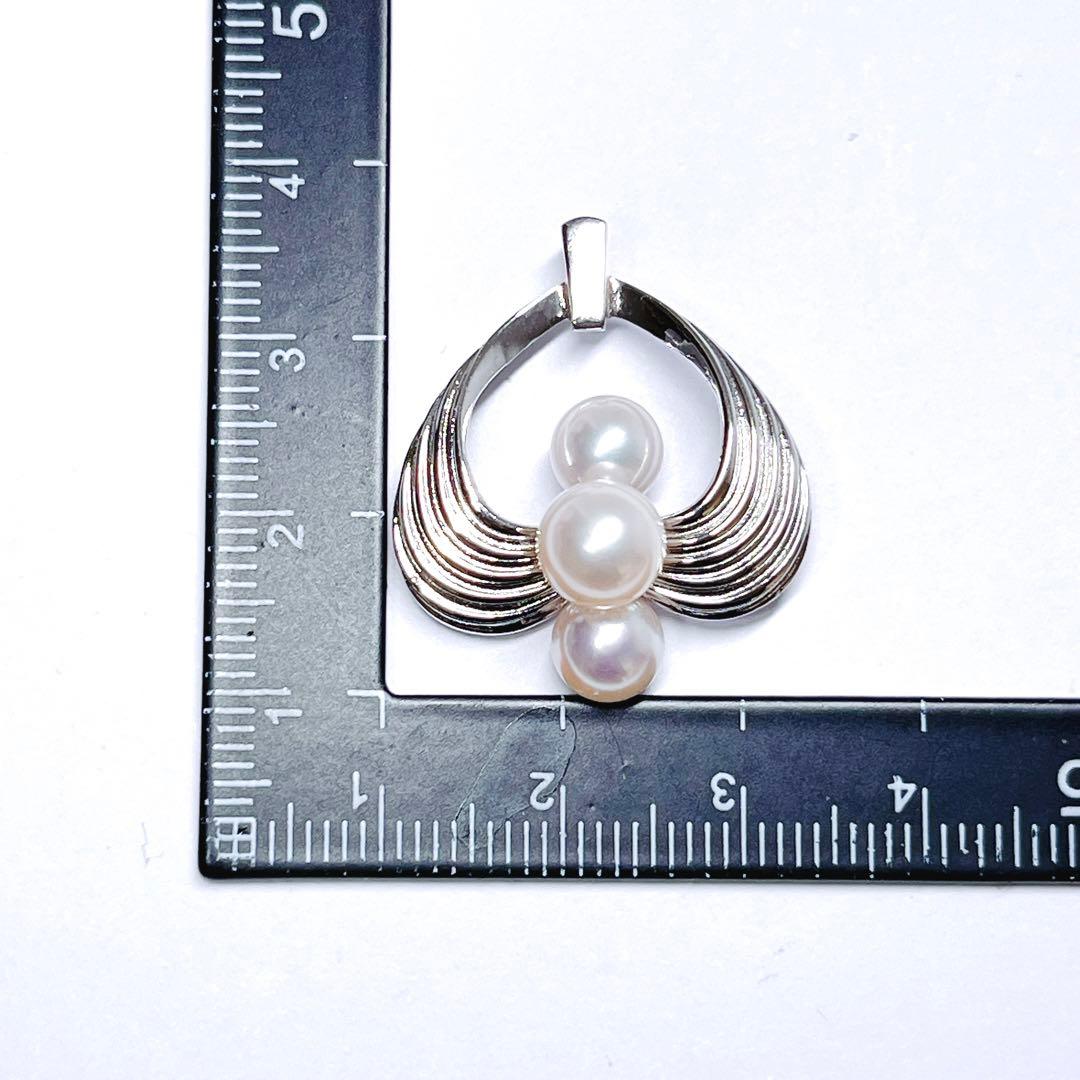 Mikimoto silver pearl necklace pendant top with 6.2-6.9mm round pearls on a white background