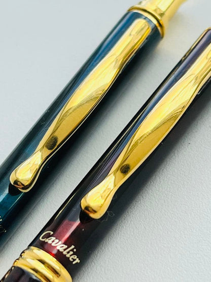 Set of two Pilot Cavalier first generation writing instruments mechanical pencil red marble and blue marble ballpoint pen
