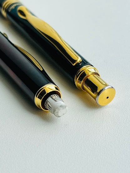 Set of two Pilot Cavalier first generation writing instruments mechanical pencil red marble and blue marble ballpoint pen