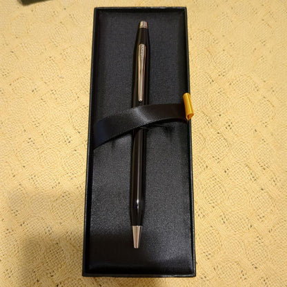 CROSS black metal ballpoint pen with slim design displayed next to a black gift box