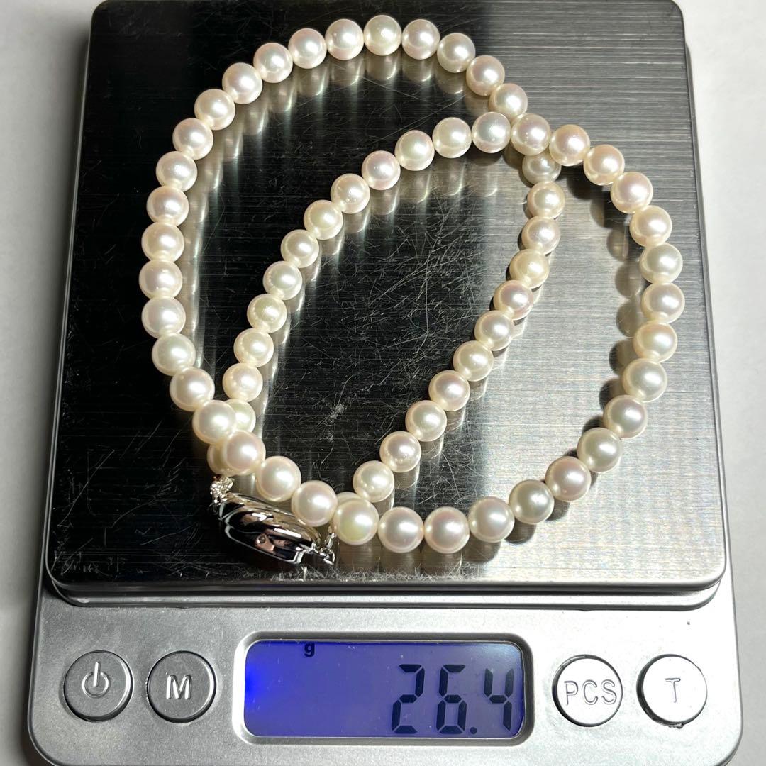 Aurora Interference color Akoya pearl necklace with 6.0-6.5mm white pearls and silver clasp on a white background