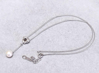 Tasaki Akoya pearl necklace in silver with 42.5cm length displayed with its box