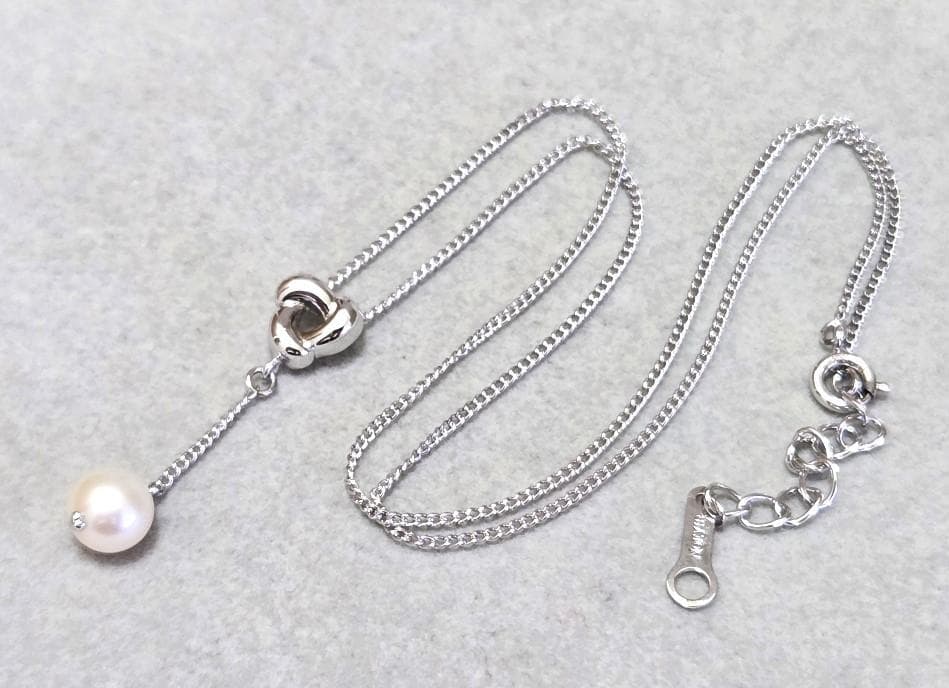 Tasaki Akoya pearl necklace in silver with 42.5cm length displayed with its box