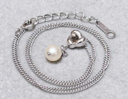 Tasaki Akoya pearl necklace in silver with 42.5cm length displayed with its box