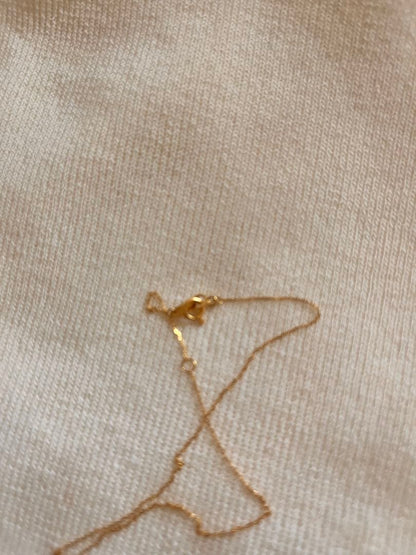 Agete K18 gold necklace with diamond pendant on a white background showing 40 cm length