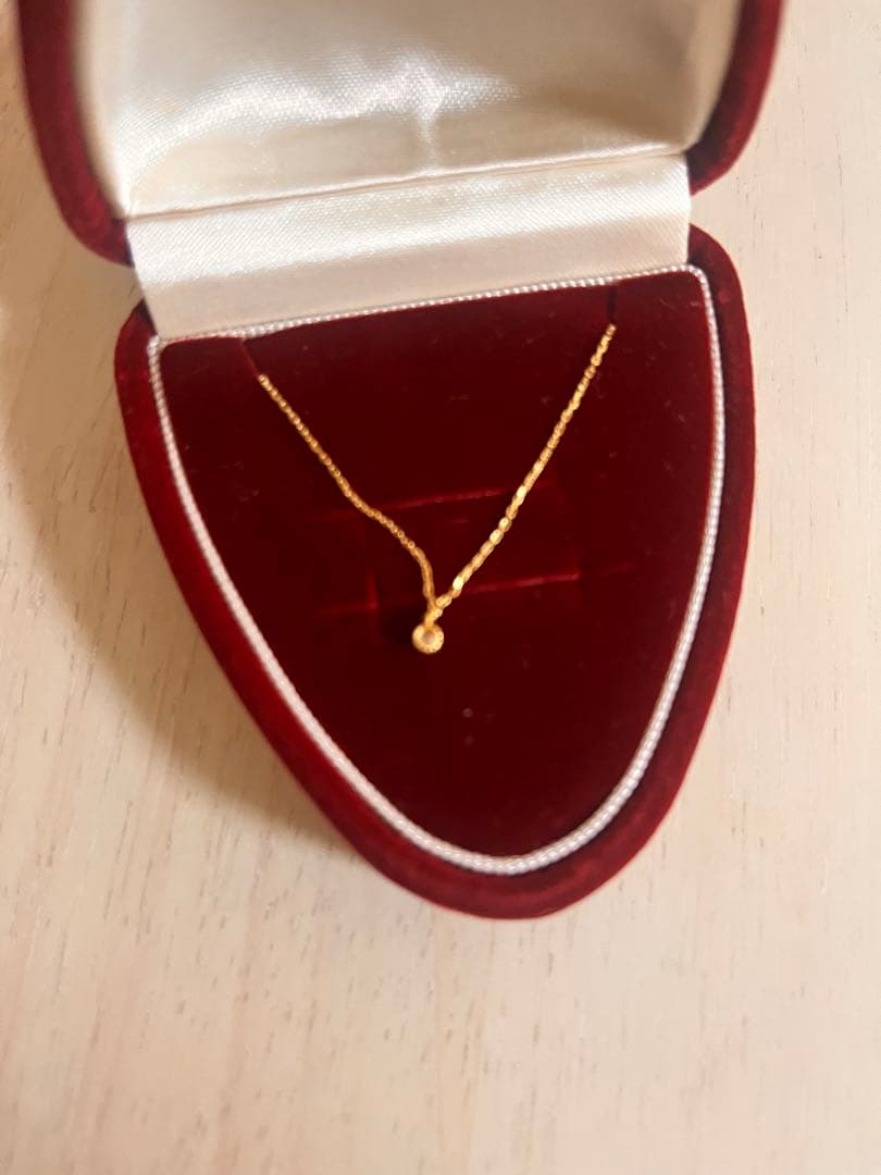 Agete K18 gold necklace with diamond pendant on a white background showing 40 cm length