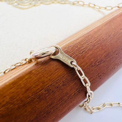 Agete Transparent Plate Necklace in silver material with gold color, 2.6 cm top length on 50 cm chain