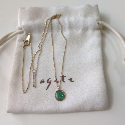 Agete octagonal gold necklace featuring a green octagonal stone pendant on a delicate chain