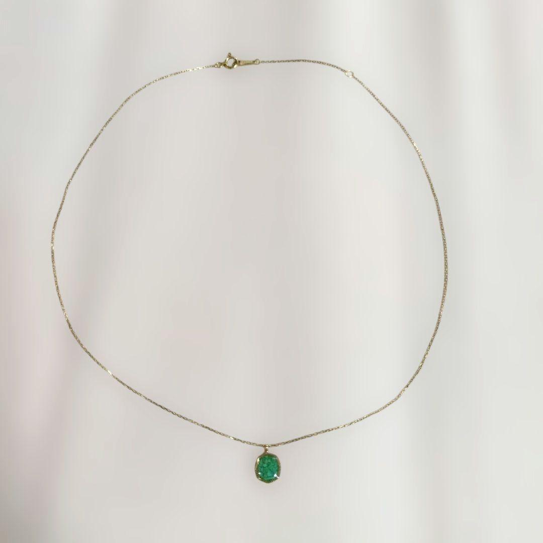 Agete octagonal gold necklace featuring a green octagonal stone pendant on a delicate chain