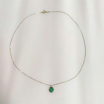 Agete octagonal gold necklace featuring a green octagonal stone pendant on a delicate chain