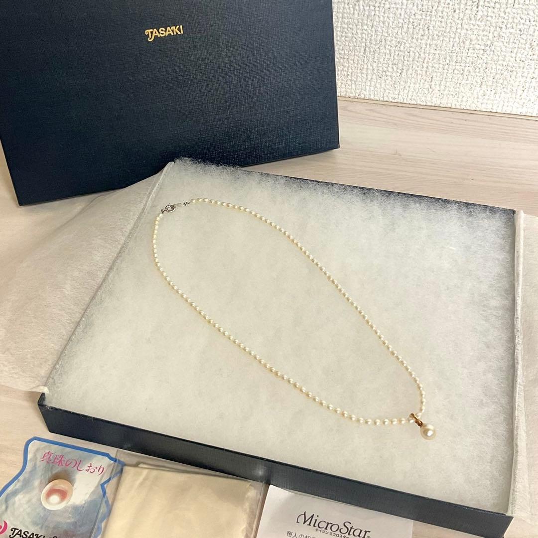 TASAKI baby pearl necklace with K18 gold pendant and Akoya pearls displayed with original box
