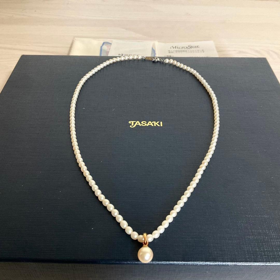 TASAKI baby pearl necklace with K18 gold pendant and Akoya pearls displayed with original box