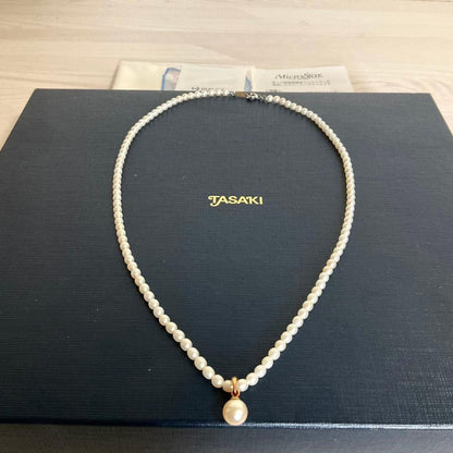 TASAKI baby pearl necklace with K18 gold pendant and Akoya pearls displayed with original box